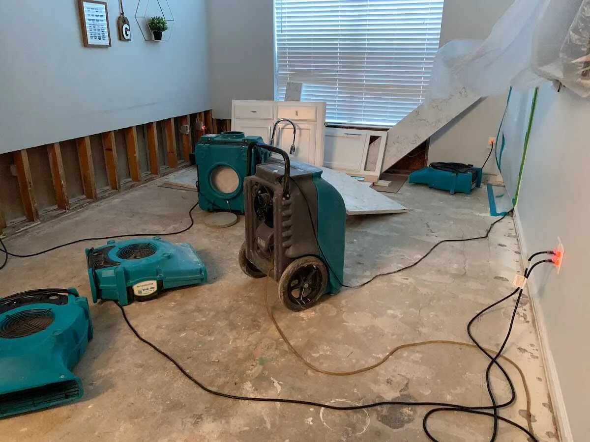 Dehumidifier in flood-cut room for Water Damage Restoration in Genoa